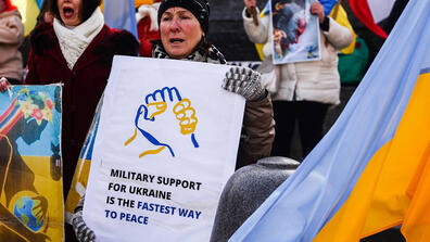 person holding sign for Ukraine