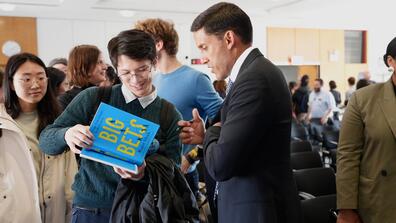 Dr. Rajiv Shah signs a copy of his book, Big Bets, at a Columbia SIPA event on October 10, 2023