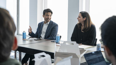 Zayn Siddique (left) and Betsy Ankney (right) confer during a workshop