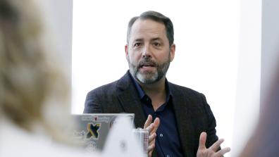 Chad Sweet speaks at a roundtable event