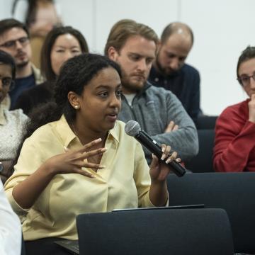 student speaking into microphone