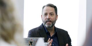 Chad Sweet speaks at a roundtable event