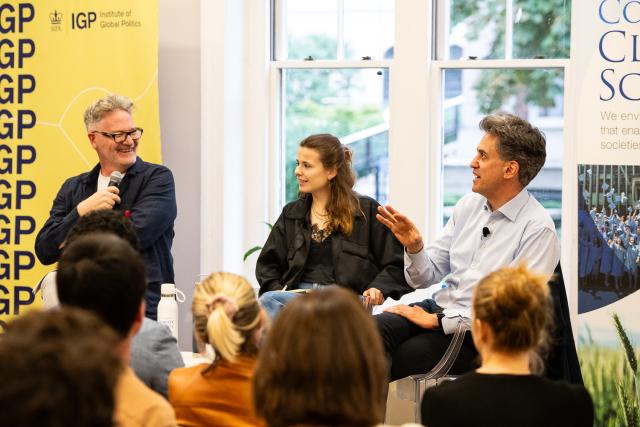 Adam Tooze (left), Luisa Neubauer (center), and Ed Miliband (right) address students at the roundtable