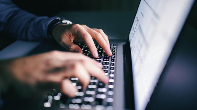 Person typing on a laptop